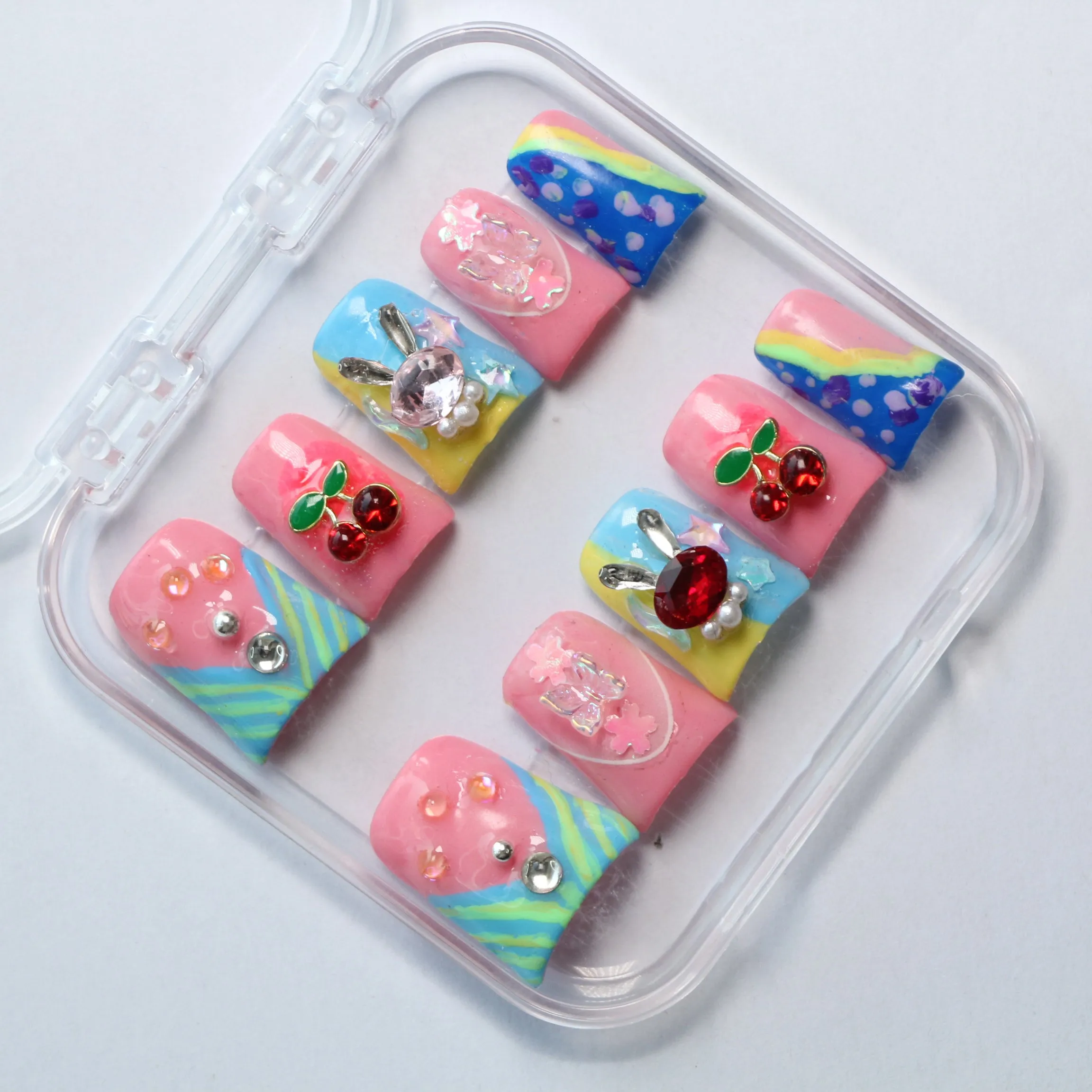 Pink and blue fairytale nail art: a lovely adventure embellished with gemstones